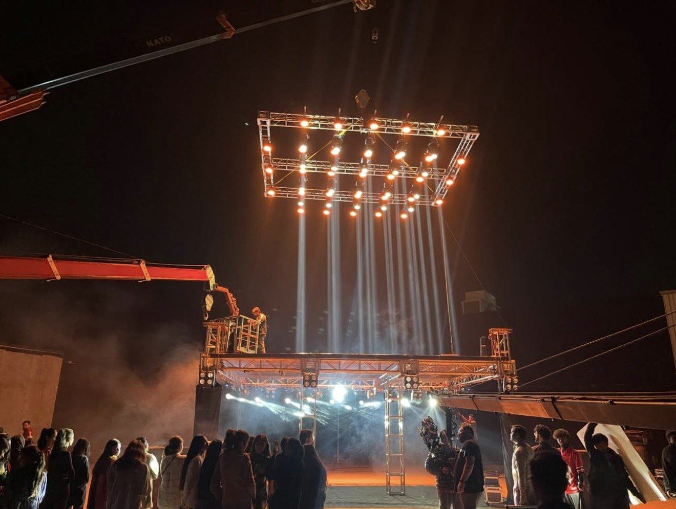 Crane-mounted lighting rig on an ad shoot