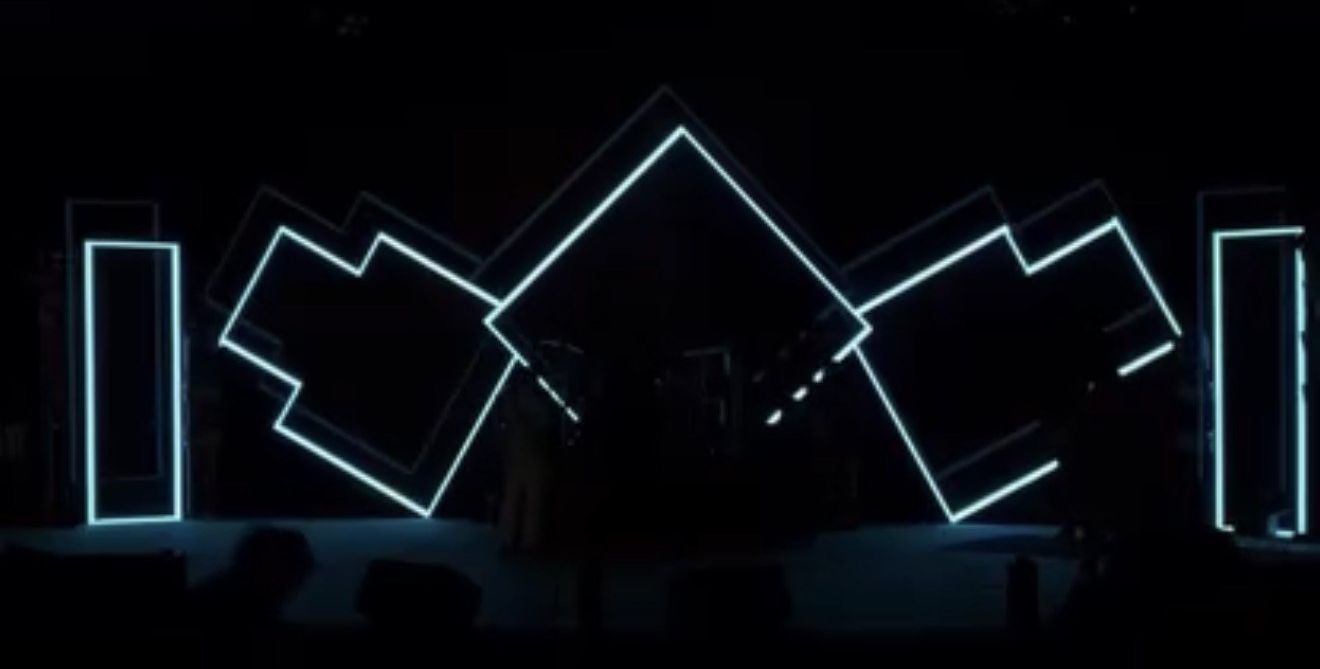 Neon-outlined stage backdrop